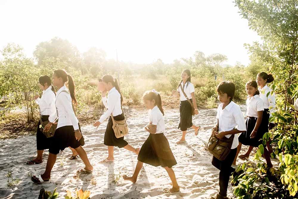 Students walking on the island, part of the Song Saa Foundation
