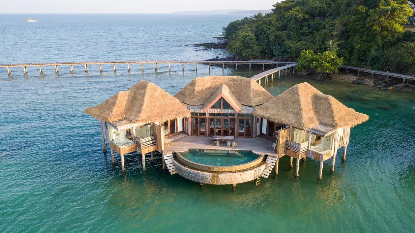 Aerial of overwater villa and jetty