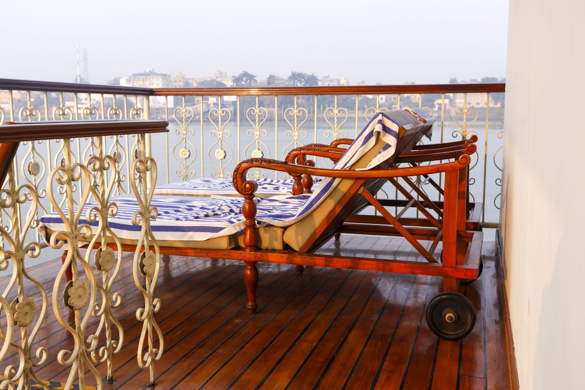Private balcony lounger overlooking the Ganges from an Antara cruise suite