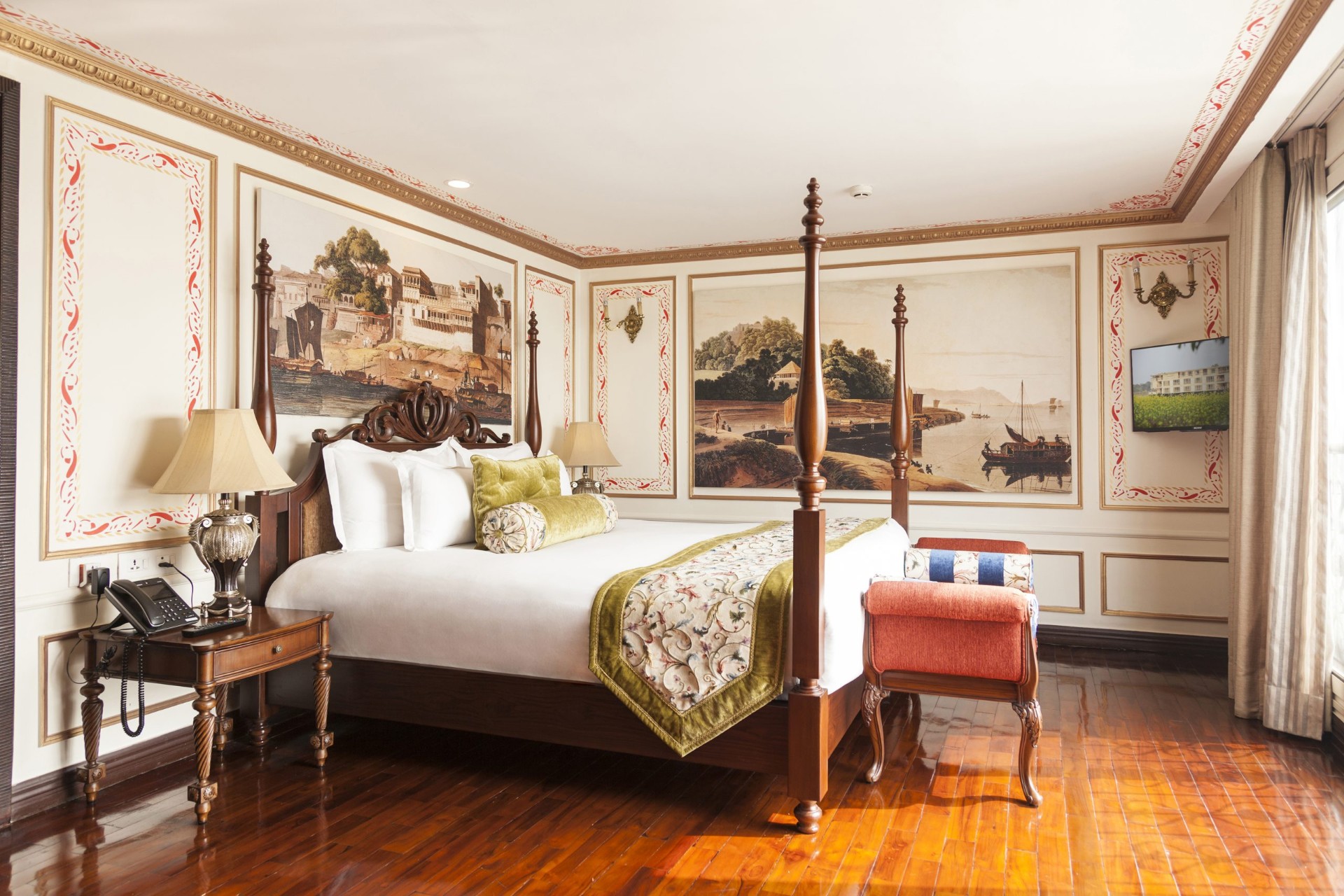 Viceroy Suite aboard Antara's Ganges Voyager II with four-poster bed and Indian-inspired murals