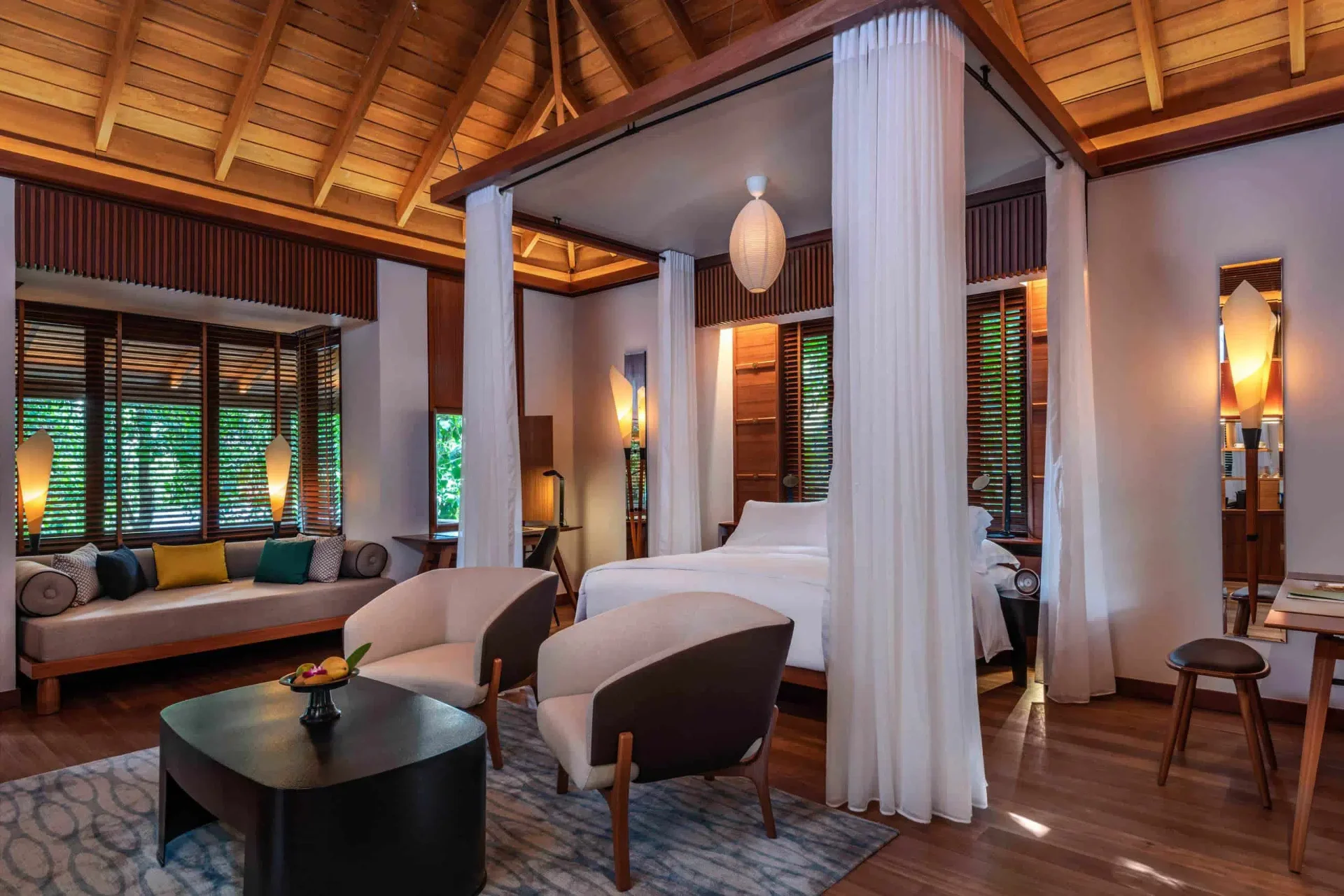 Rainforest Villa bedroom with canopy bed and timber ceilings at The Datai Langkawi