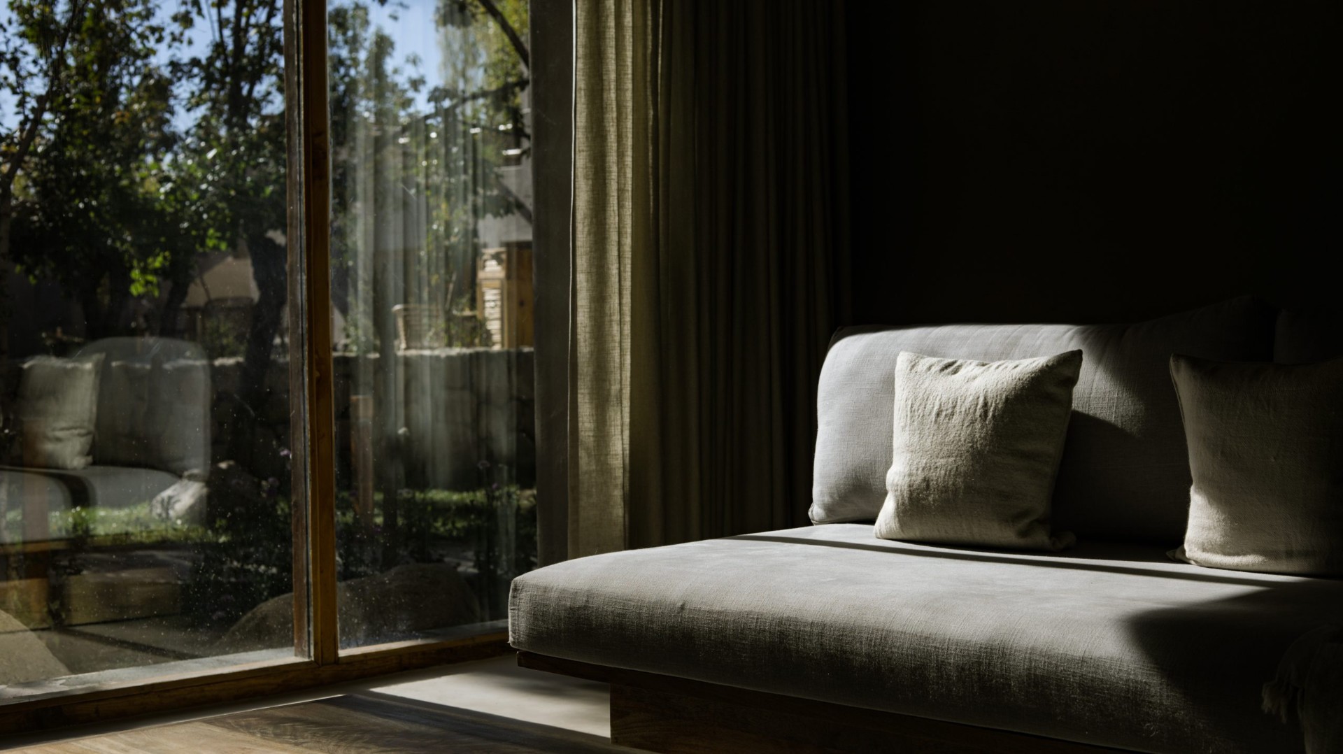 Dolkhar lounge with natural light and garden views