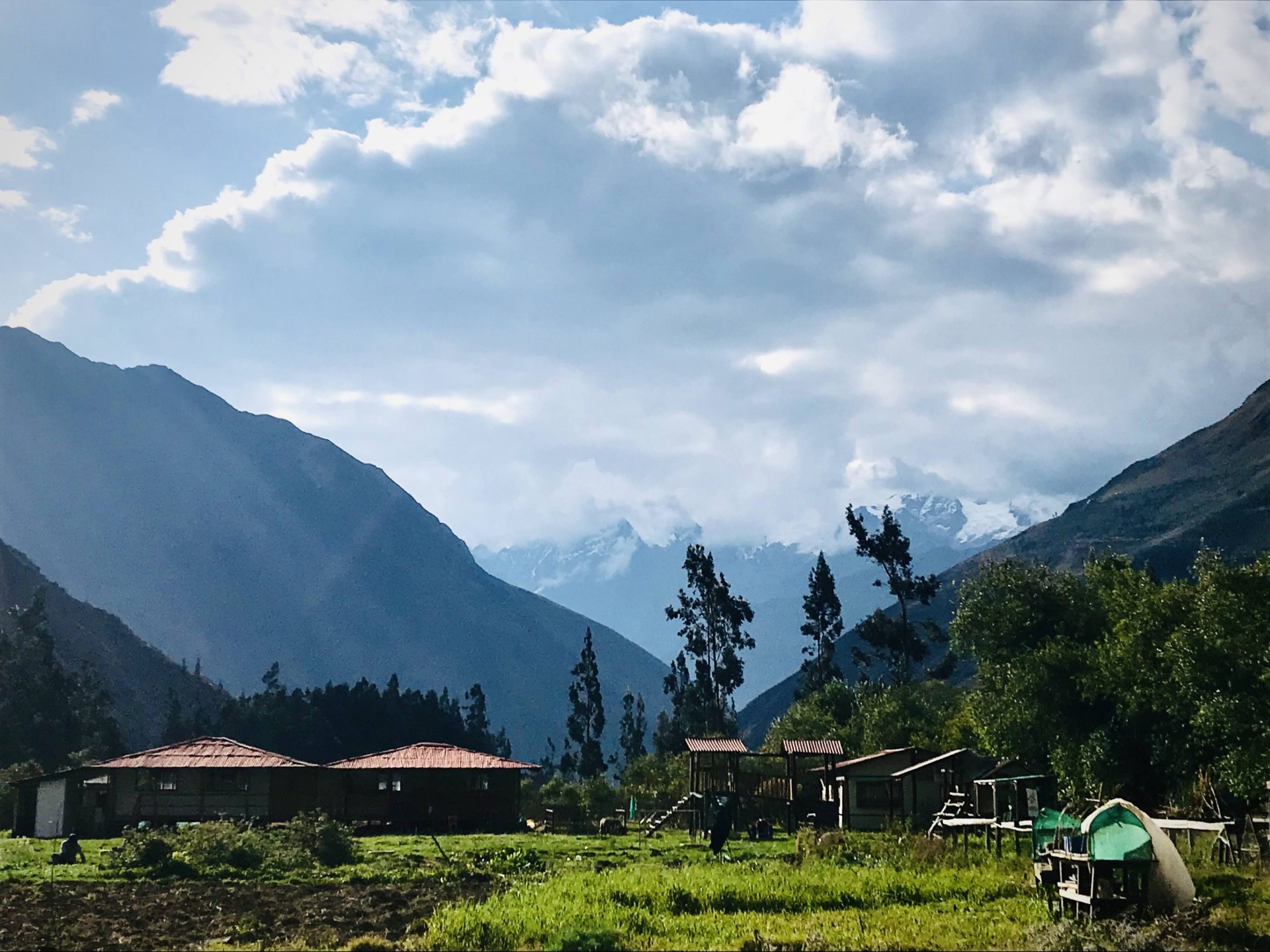 Kuska School in the Sacred Valley supported by El Albergue, with the Andes mountains beyond