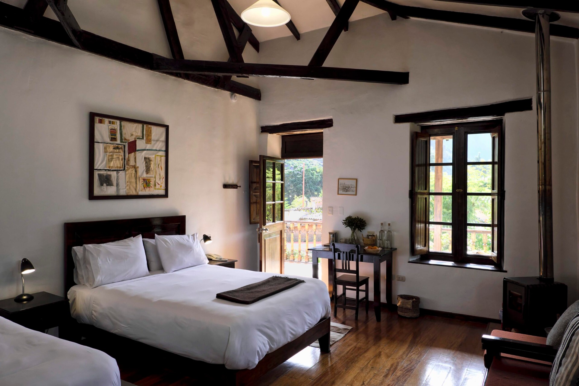 Heritage suite at El Albergue Ollantaytambo with wood-burning stove and Sacred Valley views