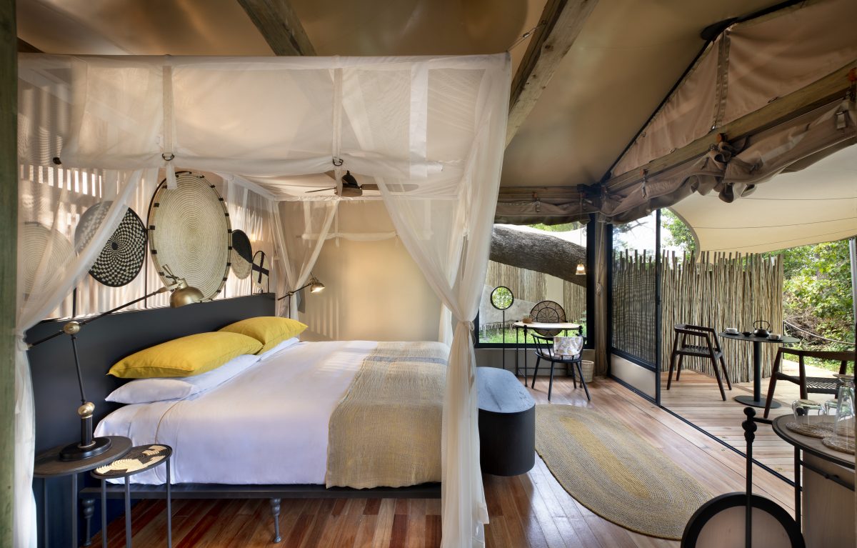 Luxury tented bedroom with canopy net and artisan décor