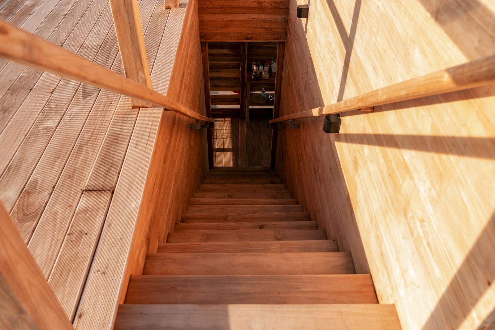 Wooden staircase descending to the underwater room