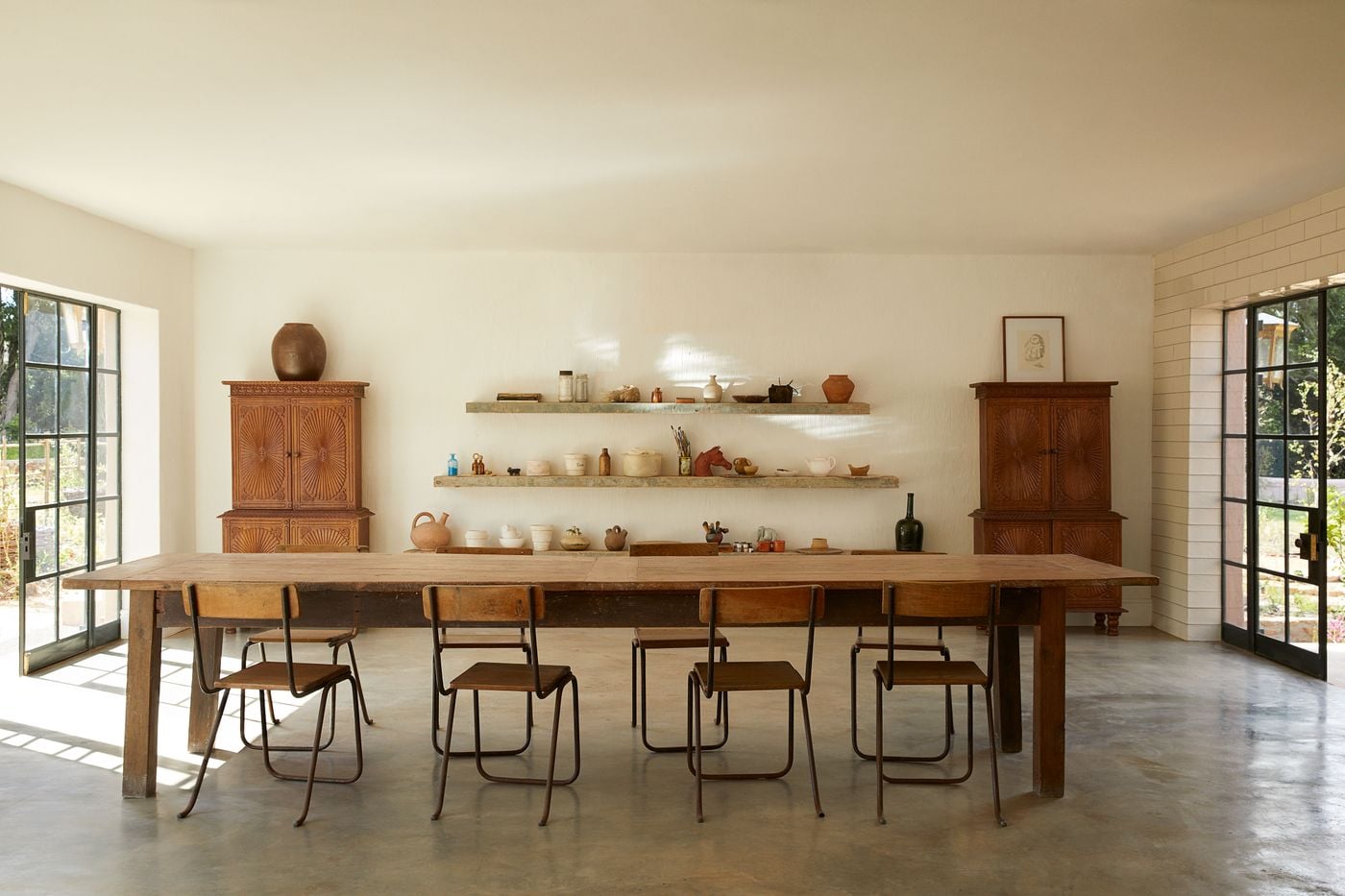 Communal dining room with rustic wooden table