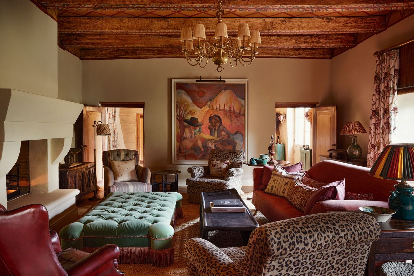 Eclectic living room with South African art and fireplace