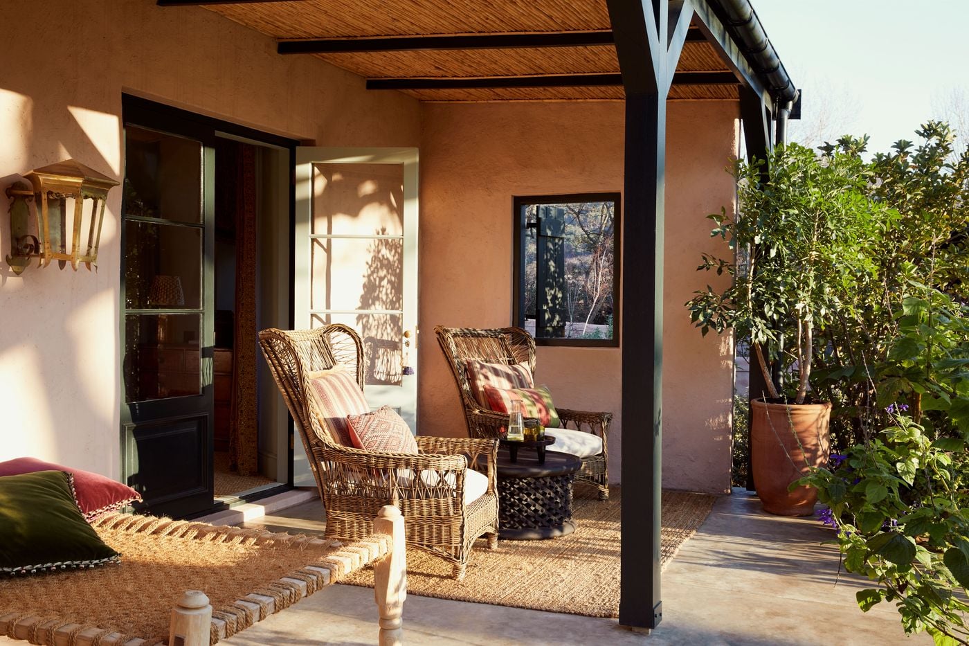 Wicker-furnished veranda with garden views