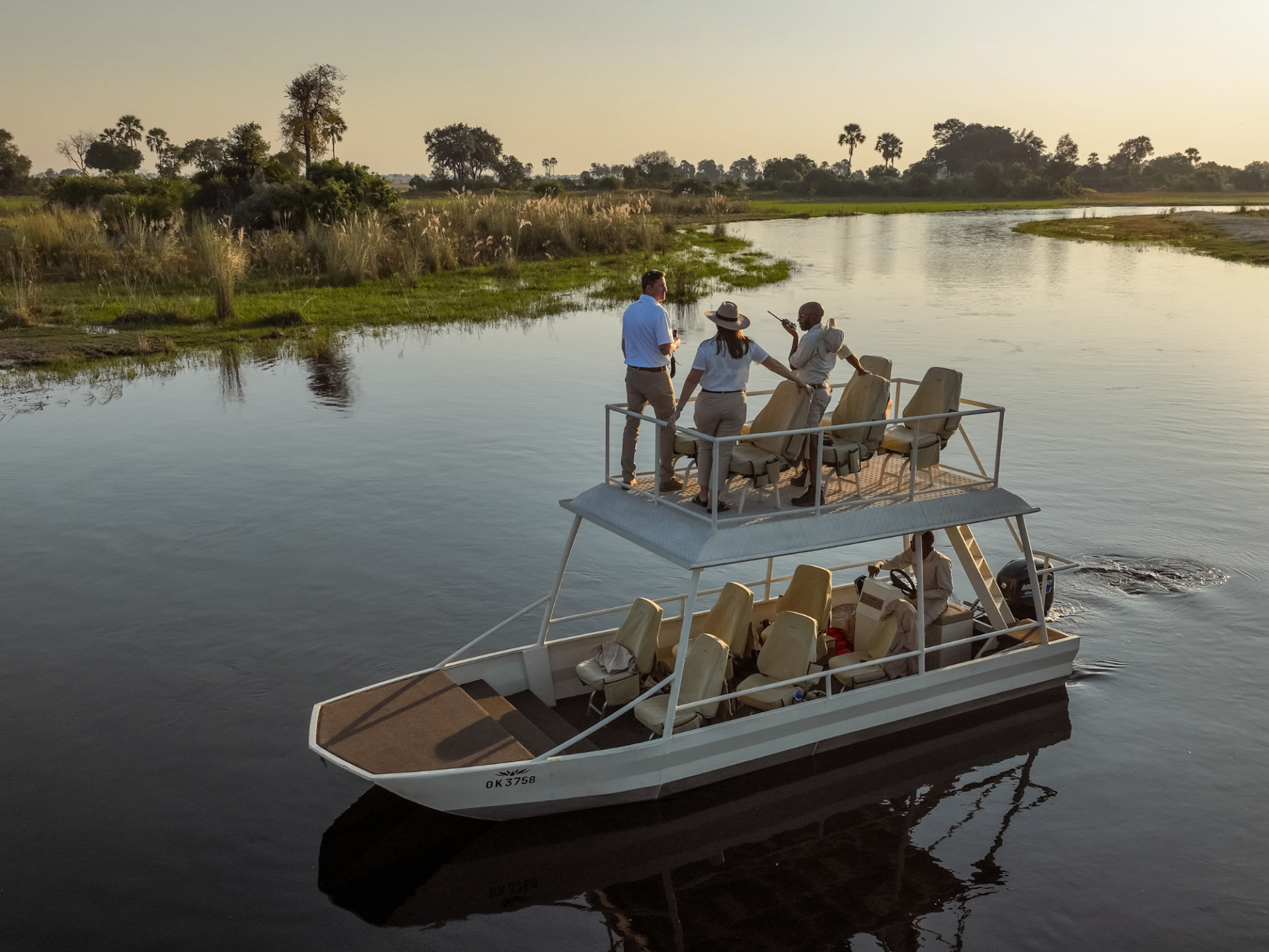 Boat cruise on the Okavango Delta at golden hour