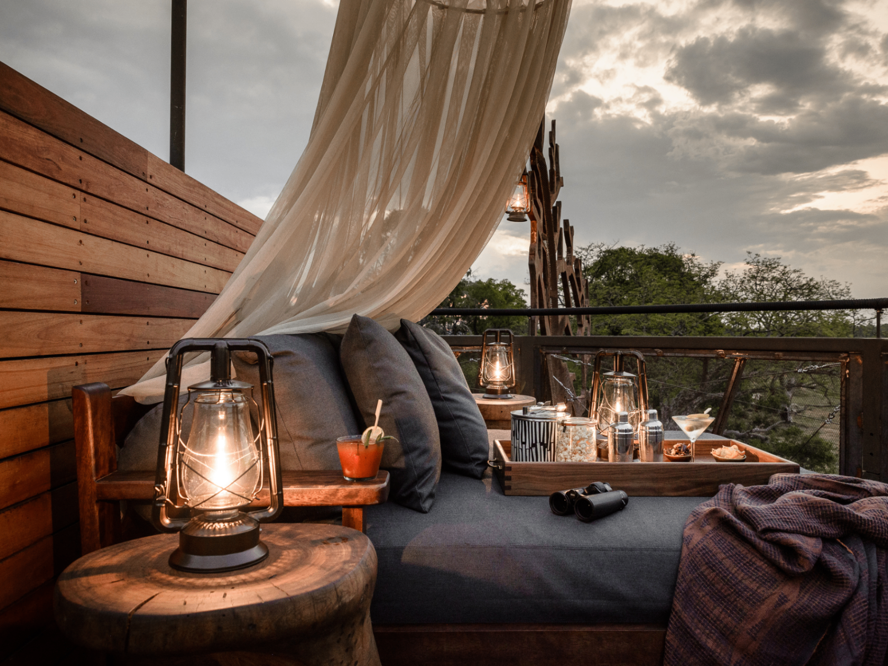 Baobab Treehouse deck with lanterns at sunset